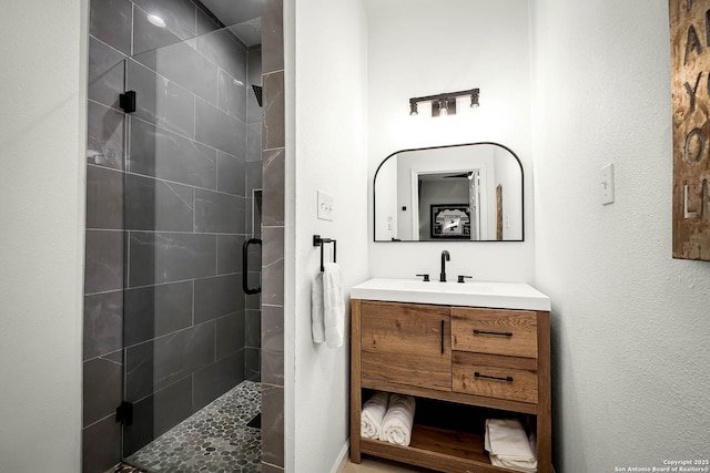 bathroom with vanity and walk in shower