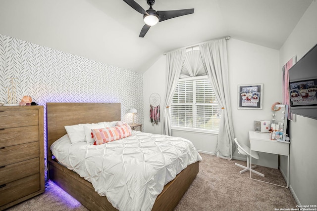 bedroom featuring lofted ceiling, ceiling fan, and carpet flooring