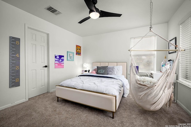 bedroom featuring ceiling fan and carpet