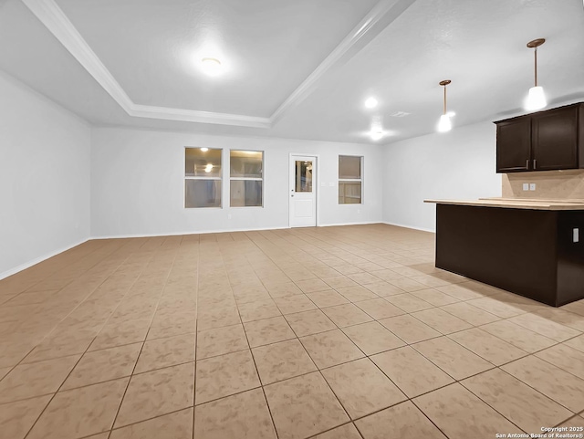 unfurnished living room featuring a tray ceiling and light tile patterned flooring