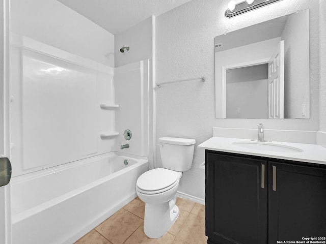 full bathroom featuring washtub / shower combination, tile patterned floors, toilet, a textured ceiling, and vanity