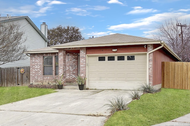 view of front of home with a garage and a front lawn