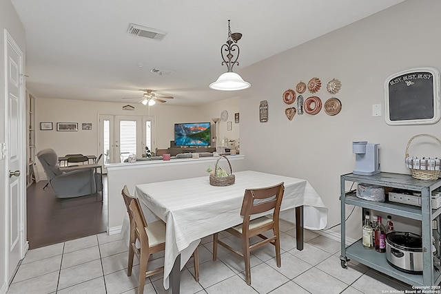 tiled dining room with ceiling fan