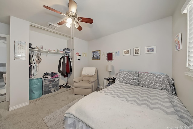 carpeted bedroom featuring a closet and ceiling fan