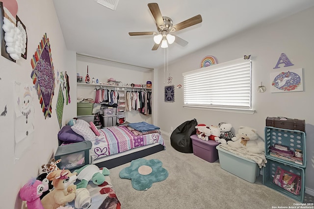 bedroom featuring a closet, ceiling fan, and carpet