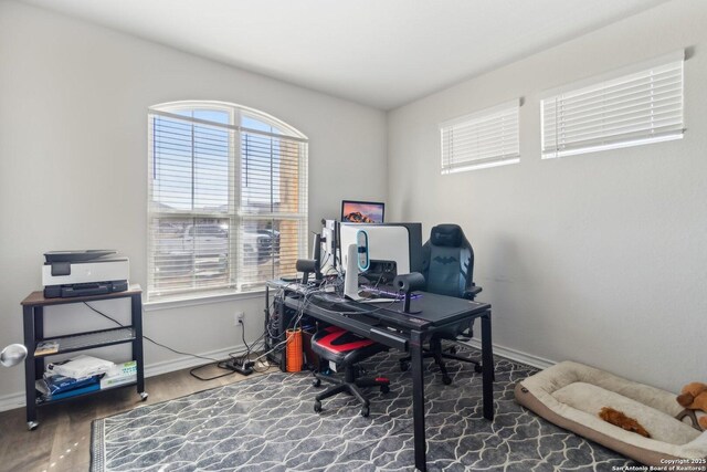 home office with wood-type flooring