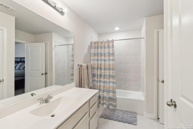 bathroom with shower / tub combo with curtain, tile patterned floors, and vanity