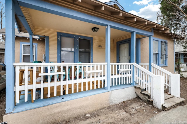 doorway to property featuring covered porch