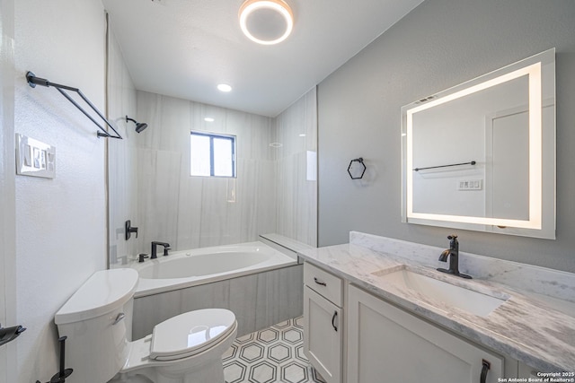 full bathroom with vanity, tiled shower / bath combo, tile patterned floors, and toilet