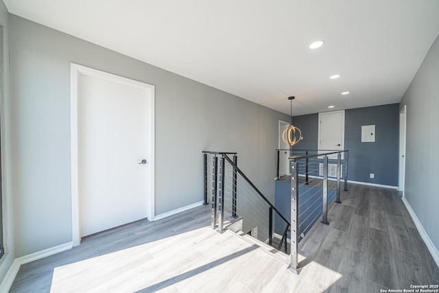 staircase featuring hardwood / wood-style floors