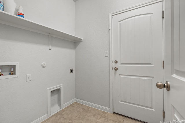 laundry area featuring electric dryer hookup, hookup for a washing machine, gas dryer hookup, and light tile patterned flooring