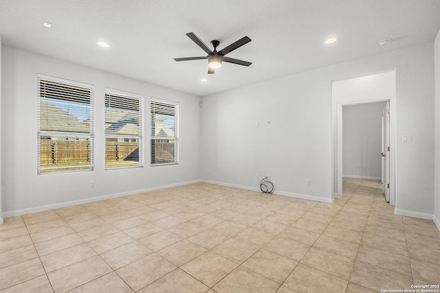 unfurnished room featuring light tile patterned flooring and ceiling fan