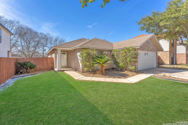 view of front of house featuring a garage and a front yard