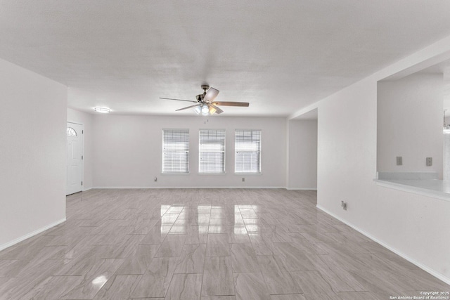 spare room with ceiling fan