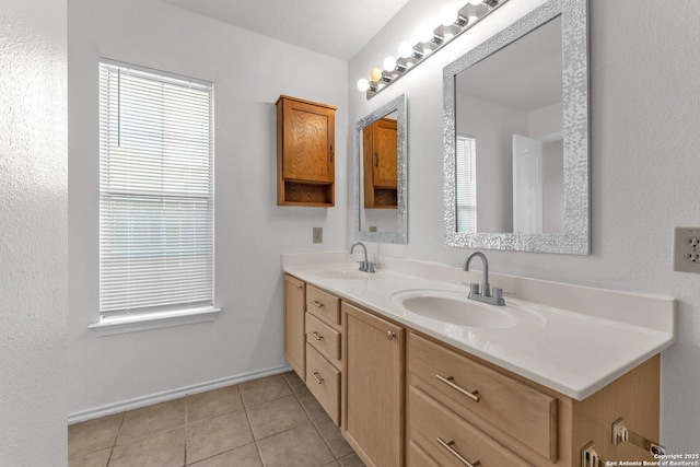 bathroom featuring tile patterned flooring and vanity