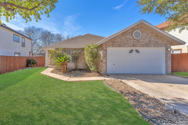 view of front of property with a garage and a front yard