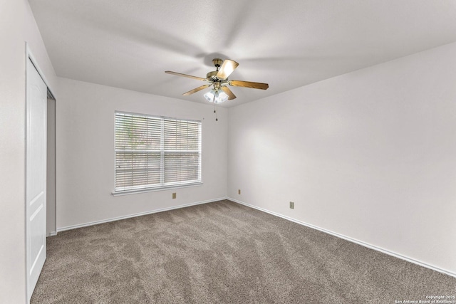 unfurnished bedroom with ceiling fan and carpet flooring