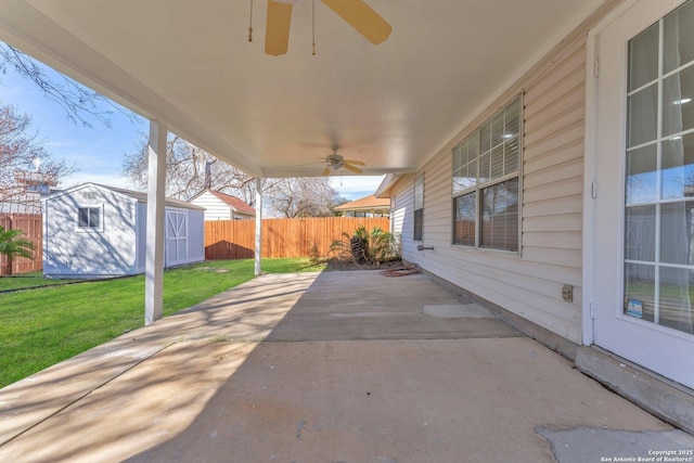 view of patio / terrace featuring ceiling fan and a storage unit