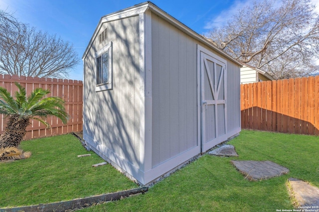 view of outbuilding with a lawn