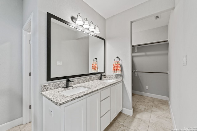 bathroom with vanity and tile patterned floors