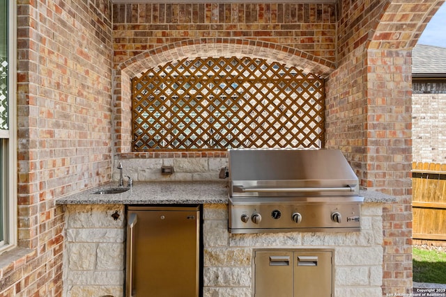 view of patio / terrace featuring a sink, grilling area, and area for grilling