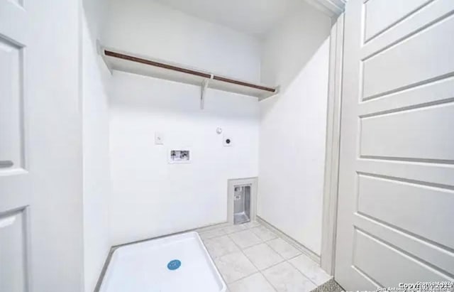 laundry area with hookup for a gas dryer, hookup for a washing machine, and hookup for an electric dryer