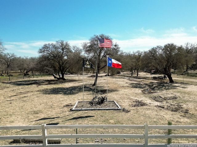 view of yard with a rural view