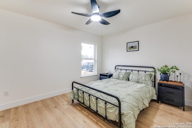 bedroom with ceiling fan and wood-type flooring