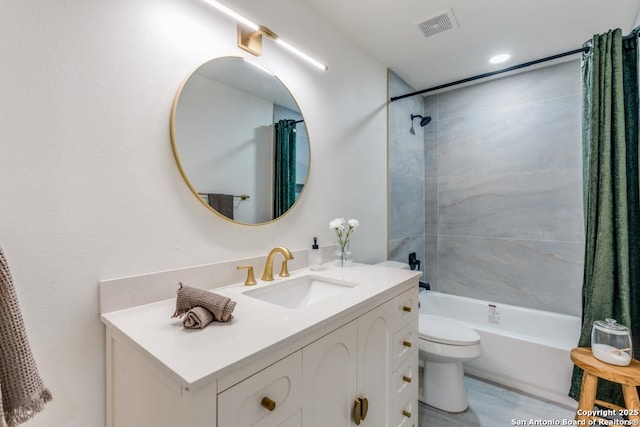 full bathroom featuring shower / bath combination with curtain, vanity, and toilet