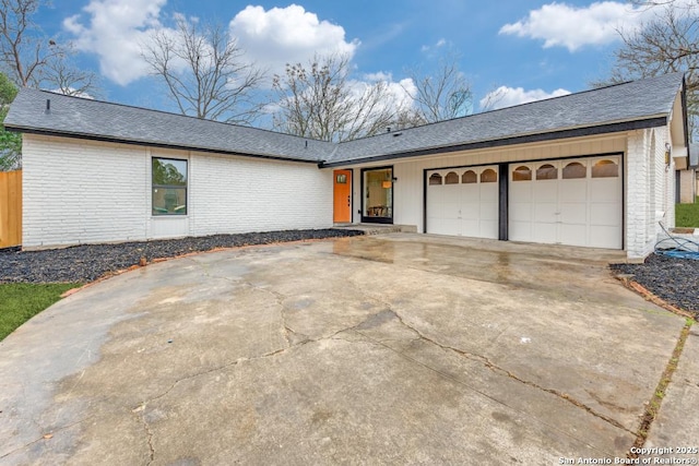 single story home featuring a garage