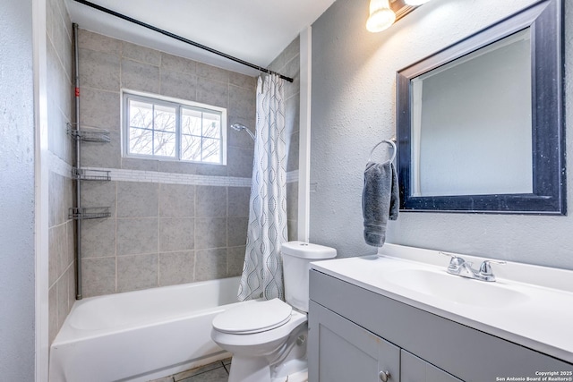 full bathroom featuring vanity, shower / bath combo, and toilet