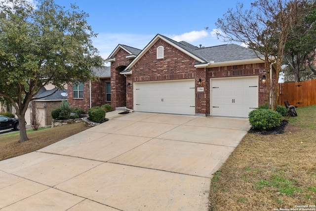 view of front of property with a garage and a front yard