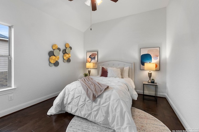 bedroom featuring lofted ceiling, dark wood-type flooring, and ceiling fan