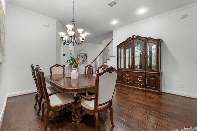 dining space with ornamental molding, dark hardwood / wood-style floors, and a notable chandelier