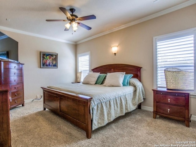 carpeted bedroom featuring ceiling fan and ornamental molding