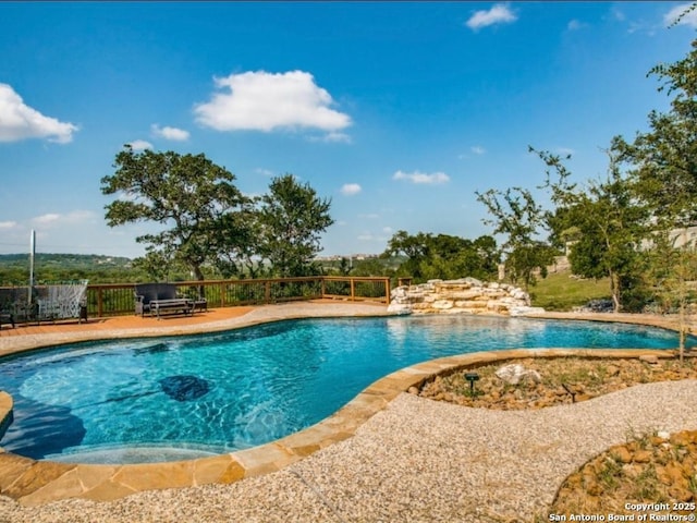 view of swimming pool with a patio area