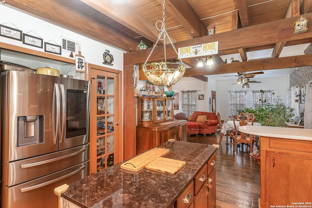 kitchen featuring a kitchen island, pendant lighting, beamed ceiling, dark hardwood / wood-style flooring, and stainless steel refrigerator with ice dispenser