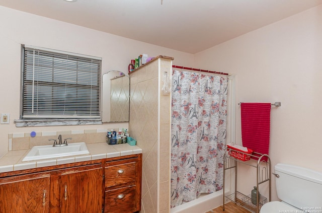 bathroom with vanity, toilet, and a shower with shower curtain