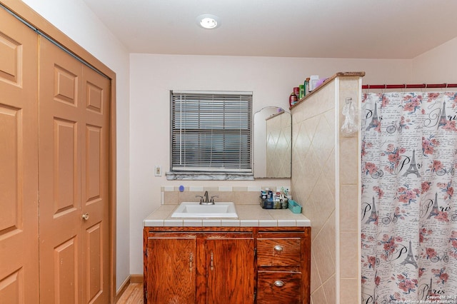 bathroom with vanity and a shower with curtain