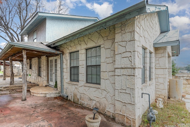 view of property exterior with a patio