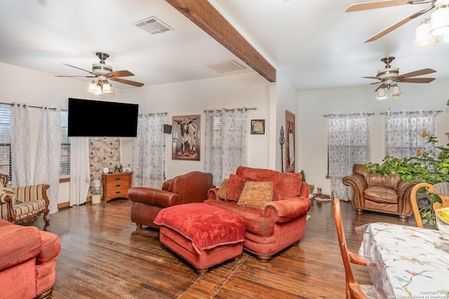 living room with beamed ceiling, dark wood-type flooring, and ceiling fan