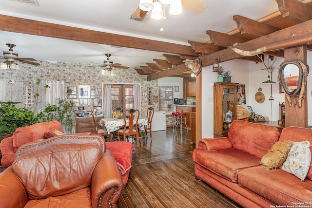 living room with beam ceiling, dark wood-type flooring, and ceiling fan