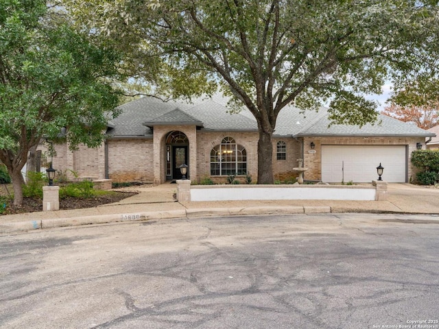 view of front of property with a garage