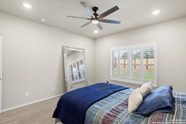 bedroom with ceiling fan and carpet floors