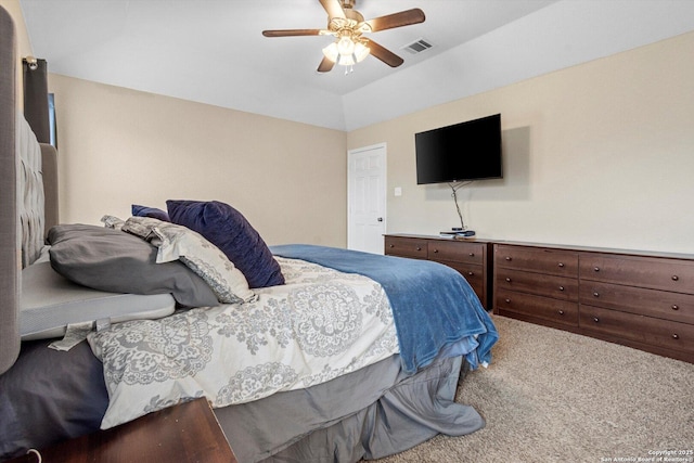 carpeted bedroom featuring ceiling fan and lofted ceiling