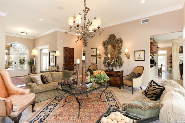 living room with french doors, ornamental molding, an inviting chandelier, and light tile patterned floors