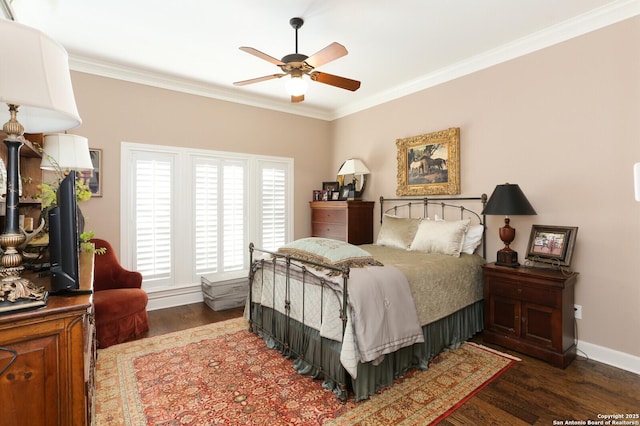 bedroom featuring ornamental molding, dark hardwood / wood-style floors, and ceiling fan