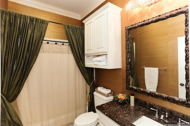 bathroom with vanity, crown molding, and toilet