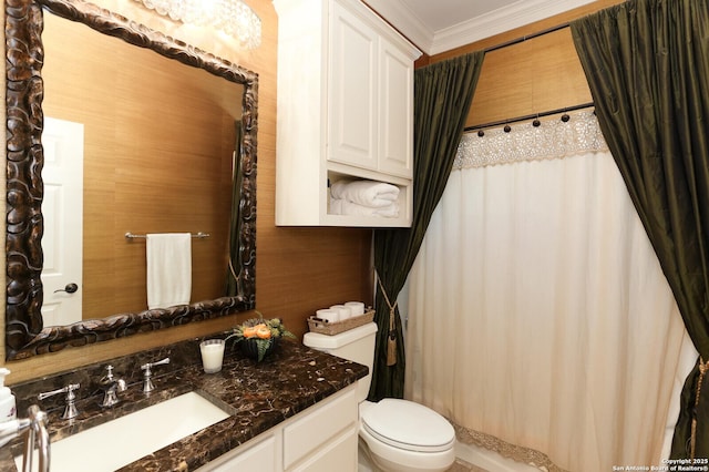 bathroom featuring vanity, ornamental molding, and toilet