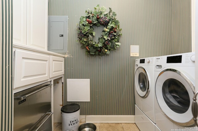 clothes washing area with separate washer and dryer, light tile patterned floors, and electric panel